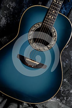 Blue shades of acoustic guitar body