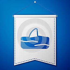 Blue Shark fin in ocean wave icon isolated on blue background. White pennant template. Vector
