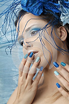 Blue shiny makeup and manicure