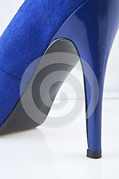 Blue shoe against white background
