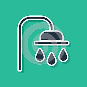 Blue Shower head with water drops flowing icon isolated on green background. Vector Illustration