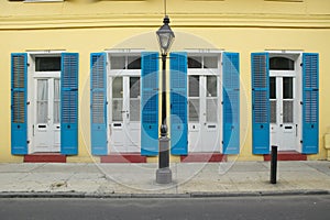 Blue shutter and lamp post in French Quarter near Bourbon Street in New Orleans, Louisiana