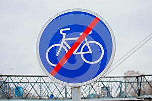 Blue sign of the end of the bike path in the city.