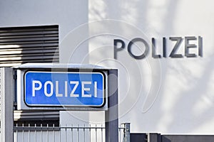 A blue sign with the inscription Polizei