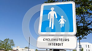 Blue sign pedestrian route road and french text cyclomoteur interdit means forbidden moped scooter banned