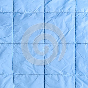 Blue silk quilted fabric as a background