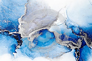 Blue silver abstract background of marble liquid ink art painting on paper .