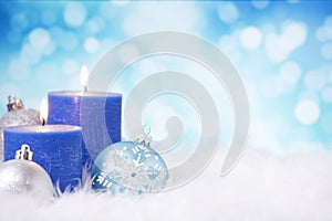 Blue and silver Christmas scene with baubles and candles