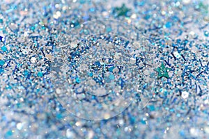 Blue and Silver Frozen Snow Winter Sparkling Stars Glitter background. Holiday, Christmas, New Year abstract texture