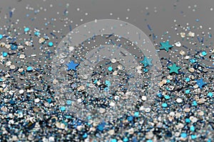 Blue and Silver Frozen Snow Winter Sparkling Stars Glitter background. Holiday, Christmas, New Year abstract texture