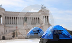 Blue sirens of police  car and the Ancient Monument in backgroun