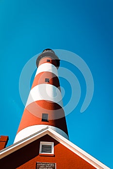 Blue skies and a candy striped Lighthouse on Assateague Island Virginia