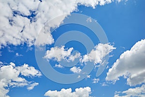 Blue skies with white and grey cumuli clouds