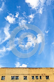 Blue sky above furbished building