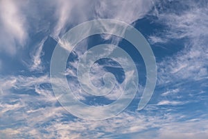 Blue sky background with big tiny stratus cirrus striped cloud