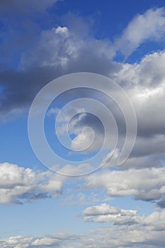 Blue sky background with clouds.Copy space. Vertical photo. Background.