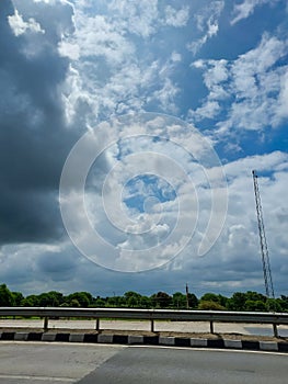 Blue sky background with cumulus white clouds, nature photography, sun rays, natural background, cloud wallpaper