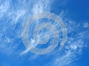 Blue sky background with fleecy clouds