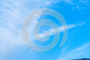 Blue sky background with green fields