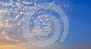 Blue sky background with group of many white fluffy Cirrocumulus clouds floating on morning sky