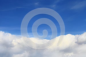 Blue sky background over white clouds