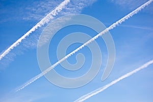 Blue sky background and plane traces.