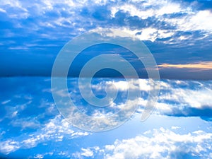 Blue sky background with tiny clouds