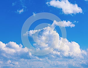 Blue sky background with tiny clouds