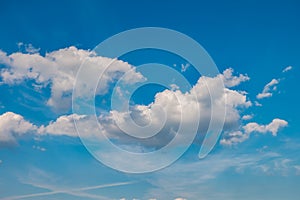 Blue sky background with tiny stratus cirrus striped clouds. Clearing day and Good windy weather