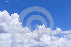 Blue sky background with white clouds, rain clouds.