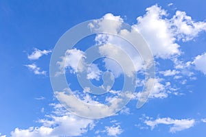 Blue sky background with white clouds, rain clouds on sunny summer or spring day