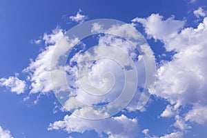 Blue sky background with white clouds, rain clouds on sunny summer or spring day