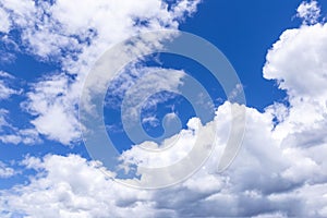 Blue sky background with white clouds, rain clouds on sunny summer or spring day