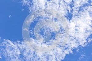 Blue sky background with white clouds, rain clouds on sunny summer or spring day