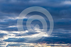 Blue sky background with white clouds sun rays autumn day