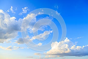 Blue sky background and white clouds in sunny day before sunset