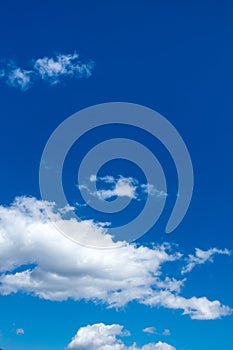 Blue sky background with white clouds vertical image