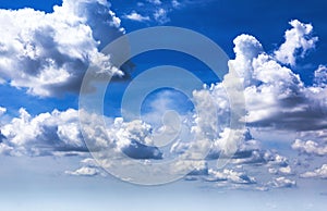 blue sky background with white cumulus clouds