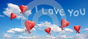 Blue sky with balloon hearts and love you message