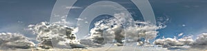 Blue sky with beautiful dark clouds before storm. Seamless hdri panorama 360 degrees angle view with zenith for use in 3d graphics