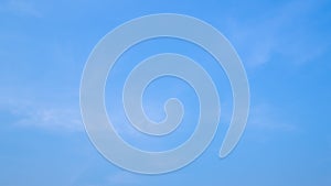 A blue sky with beautiful wisp of cloud for use as a backing or backdrop