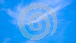 A blue sky with beautiful wisp of cloud for use as a backing or backdrop