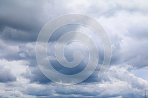 Blue sky with big white cloud, and raincloud in nature