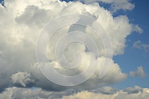 Blue sky with big white and grey clouds