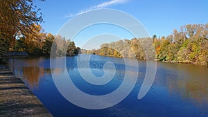 Blue sky blue river waters with autumn colors