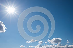 Blue sky with bright sunshine and clouds