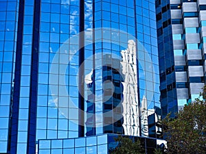 Blue Sky and Building Reflections on Glass Windows