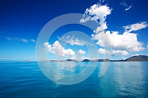 Blue sky and calm sea with white cloud