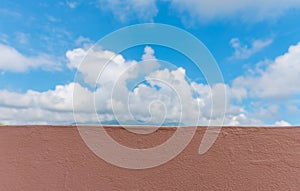 blue sky with cement wall.