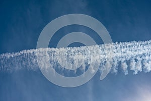 Blue sky with chemtrails or contrails